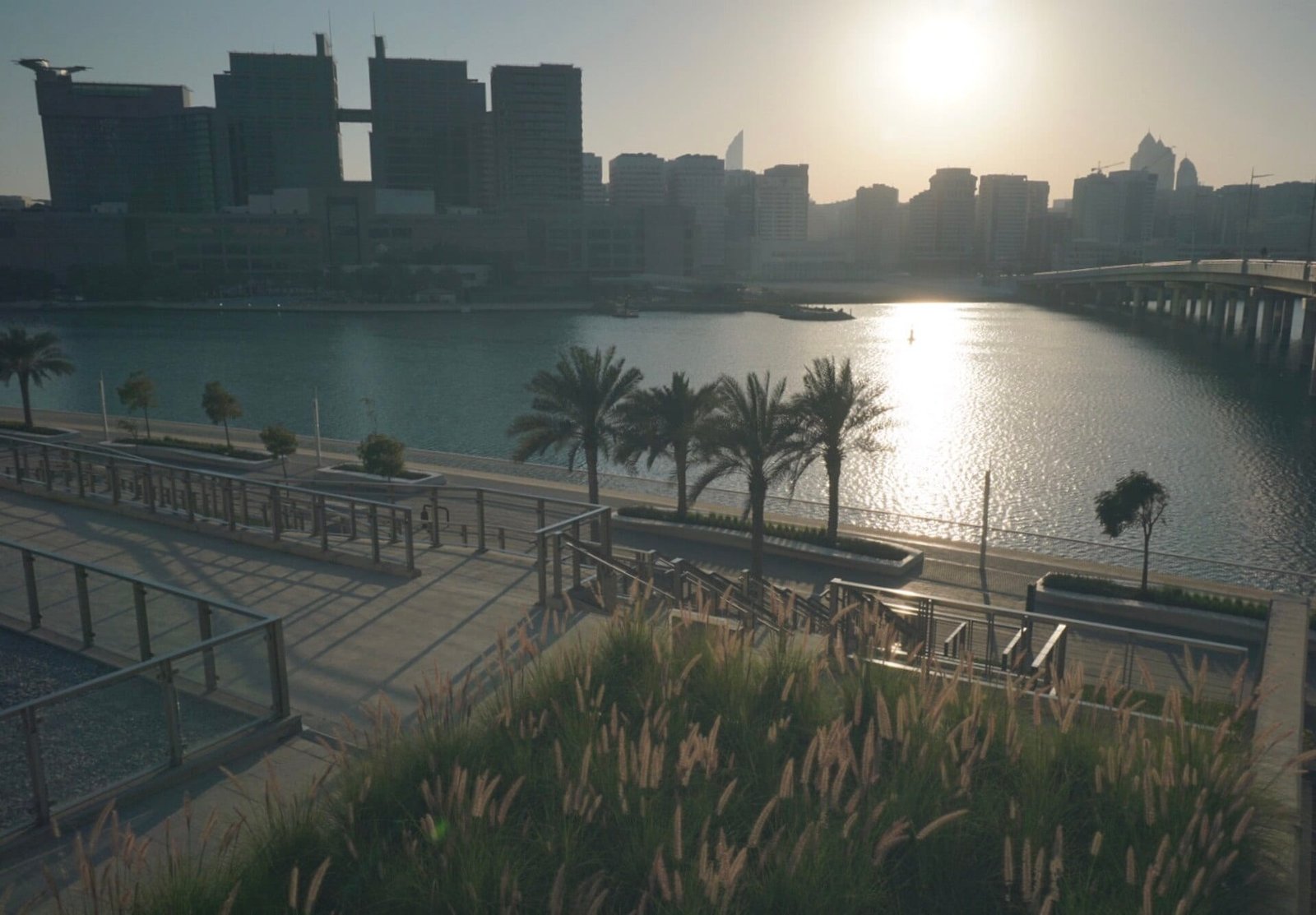 An upscale urban villa moments from the financial district — sculpted concrete, a lit motor court and interiors dressed for high-end automotive and fashion work.