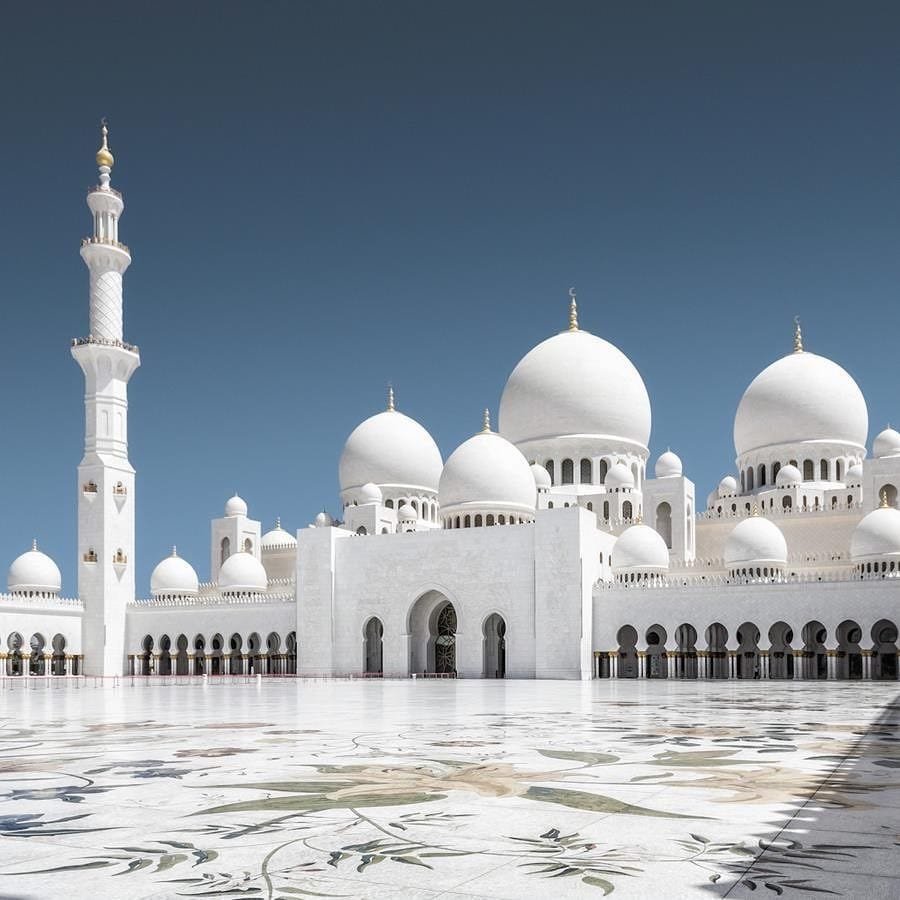 Sunlit white marble of the Sheikh Zayed Grand Mosque.